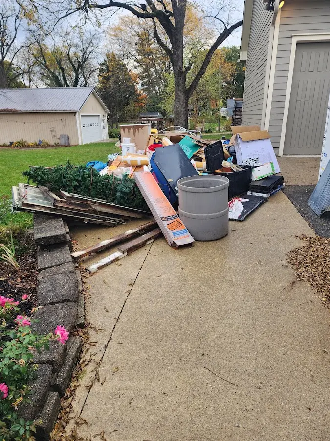 Dumpster being loaded with debris for Demolition Dumpster Rental in Carrollton